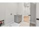 Mud room features a utility sink with cabinet space, tile floors, and access to storage at 3812 Havenrock Dr, Marietta, GA 30066