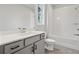 Bathroom featuring a white vanity with a gray countertop and subway tile backsplash at 3816 Havenrock Drive, Marietta, GA 30066