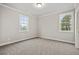 Neutral bedroom with soft carpet, white trim, and two windows providing natural light at 3816 Havenrock Drive, Marietta, GA 30066