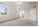 Bedroom with neutral carpet and gray walls is adjoined by an ensuite bathroom and walk-in closet at 3816 Havenrock Drive, Marietta, GA 30066