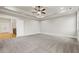 Spacious bedroom featuring tray ceiling, plush carpet flooring and access to bonus room at 3816 Havenrock Drive, Marietta, GA 30066