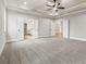 Spacious bedroom featuring tray ceiling, plush carpet flooring and double doors to bath at 3816 Havenrock Drive, Marietta, GA 30066