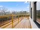 Exterior wooden deck with wooden railings and black metal supports at 3816 Havenrock Drive, Marietta, GA 30066