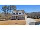 Beautiful new construction home featuring a brick and siding facade, manicured lawn, and paved driveway at 3816 Havenrock Drive, Marietta, GA 30066