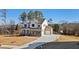 Two-story new construction home with a stone and siding exterior, paved driveway, and attached garage at 3816 Havenrock Drive, Marietta, GA 30066