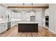 Bright kitchen with white cabinets, stainless steel appliances, and a dark wood island at 3816 Havenrock Drive, Marietta, GA 30066