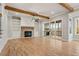 Spacious living room with hardwood flooring, fireplace, built-in shelves, exposed wood beams, and sliding glass doors at 3816 Havenrock Drive, Marietta, GA 30066