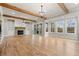 Combined living spaces with brick fireplace and access to both a deck and screened in porch at 3816 Havenrock Drive, Marietta, GA 30066
