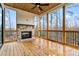 Screened porch with wood ceiling, wood floors, railings, and a brick fireplace at 3816 Havenrock Drive, Marietta, GA 30066