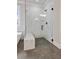 Marble shower with glass enclosure, shower bench, rainfall shower head and sleek fixtures at 3816 Havenrock Drive, Marietta, GA 30066
