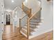 Elegant staircase with hardwood steps, iron balusters, and wood railings leading to the second floor at 3816 Havenrock Drive, Marietta, GA 30066