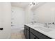 Bathroom featuring white subway tile in the shower, dark cabinets, light countertops and double sinks at 3819 Havenrock Dr, Marietta, GA 30066