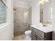 Modern bathroom with glass shower, gray vanity, and bright natural light at 3819 Havenrock Dr, Marietta, GA 30066