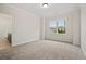Bright bedroom with carpet flooring, large window, and ensuite bathroom at 3819 Havenrock Dr, Marietta, GA 30066