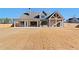 Back exterior view showing patio space, spacious backyard, and fenced property at 3819 Havenrock Dr, Marietta, GA 30066
