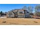 Stunning two-story home featuring a brick and siding exterior, professionally landscaped yard, and modern architectural details at 3819 Havenrock Dr, Marietta, GA 30066