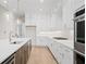 Well-lit kitchen featuring white cabinetry, stainless steel appliances, and a large center island at 3819 Havenrock Dr, Marietta, GA 30066