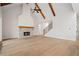 Open-concept living room with hardwood floors, fireplace, and stairs leading to the upper level of the home at 3819 Havenrock Dr, Marietta, GA 30066