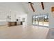 Bright living room featuring an open floor plan with hardwood floors, vaulted ceiling, and view of the kitchen at 3819 Havenrock Dr, Marietta, GA 30066