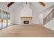 Bright, open living room with hardwood floors, vaulted ceilings, brick fireplace, and staircase to the upper level at 3819 Havenrock Dr, Marietta, GA 30066