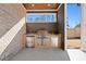 Outdoor kitchen features a stainless steel grill, sink, and mini-fridge built into a brick facade at 3819 Havenrock Dr, Marietta, GA 30066