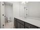 Bathroom featuring a modern vanity, white countertops, gray cabinets, and a view of the toilet at 3820 Havenrock Dr, Marietta, GA 30066