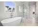Bright bathroom featuring a soaking tub and walk-in shower at 3820 Havenrock Dr, Marietta, GA 30066