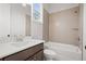 Bright bathroom featuring a shower-over-tub, light tile surround, and a modern vanity with a white countertop at 3820 Havenrock Dr, Marietta, GA 30066