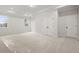 Spacious bedroom with neutral carpeting, a trey ceiling, and double doors leading to a closet at 3820 Havenrock Dr, Marietta, GA 30066