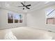 Bright, spacious bedroom featuring a tray ceiling with fan and large windows at 3820 Havenrock Dr, Marietta, GA 30066