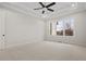 Bright bedroom featuring a trey ceiling, fan and large window at 3820 Havenrock Dr, Marietta, GA 30066
