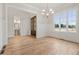 Light-filled dining area with hardwood floors, wainscoting, and large windows overlooking the yard at 3820 Havenrock Dr, Marietta, GA 30066