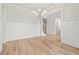 Bright dining room features wood floors, modern chandelier and white wainscoting at 3820 Havenrock Dr, Marietta, GA 30066
