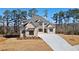 Beautiful two-story home with a modern brick facade and long concrete driveway at 3820 Havenrock Dr, Marietta, GA 30066