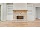 Fireplace features brick surround, wood mantle, built-ins and ship lap accent at 3820 Havenrock Dr, Marietta, GA 30066