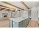 Kitchen view of large island, stainless appliances, fireplace and staircase at 3820 Havenrock Dr, Marietta, GA 30066