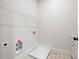 Laundry room with white cabinets and utility sink at 3820 Havenrock Dr, Marietta, GA 30066