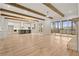 Open living space features wood beam accents, fireplace and access to outdoor patio at 3820 Havenrock Dr, Marietta, GA 30066