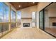 Covered patio featuring a brick fireplace, wood ceiling, and sliding glass doors leading to the interior at 3820 Havenrock Dr, Marietta, GA 30066