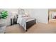 Bright bedroom with neutral walls and carpet, and stylish dark wood furniture at 5965 Ellington Cv, Cumming, GA 30040
