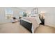 Inviting primary bedroom with natural light, plush carpet, and calming neutral tones at 5965 Ellington Cv, Cumming, GA 30040