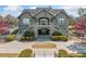 Attractive clubhouse entrance with symmetrical stairs, landscaping, and covered entryway at 5965 Ellington Cv, Cumming, GA 30040