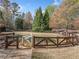 Fenced dog park area with a double gated entry at 5965 Ellington Cv, Cumming, GA 30040