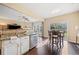 Modern kitchen features granite countertops, stainless steel appliances, and hardwood floors at 5965 Ellington Cv, Cumming, GA 30040