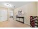 Loft area with console table and office access, featuring neutral walls and carpet at 5965 Ellington Cv, Cumming, GA 30040