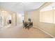 Loft area offers space for an office with neutral walls and carpet flooring at 5965 Ellington Cv, Cumming, GA 30040