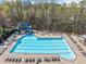 Community pool with a slide and a separate area for swimming lanes at 5965 Ellington Cv, Cumming, GA 30040