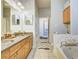 Spacious bathroom with double sinks, granite countertops, soaking tub, and tile flooring at 350 Peters Sw St # 19, Atlanta, GA 30313