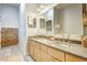 Bathroom featuring double sinks, granite countertops, and a view of the storage at 350 Peters Sw St # 19, Atlanta, GA 30313