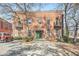 Brick building with a green door, small balconies, and ample parking spaces in front at 350 Peters Sw St # 19, Atlanta, GA 30313